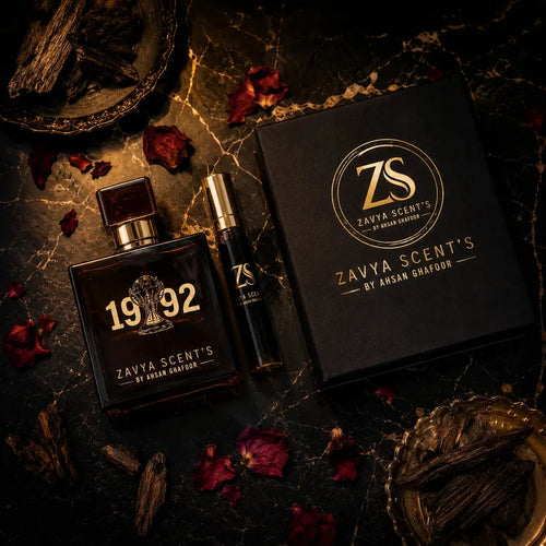 Zaya Scent's perfume bottles and packaging on a dark surface with rose petals.